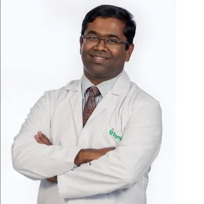 Dr. Mohan Puttaswamy
