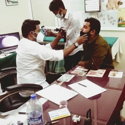 Dr. Kiran B