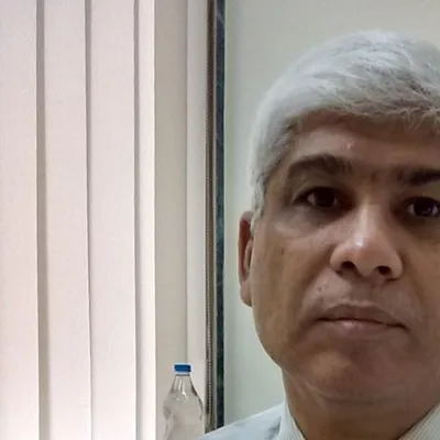 Dr. Kishore Manek