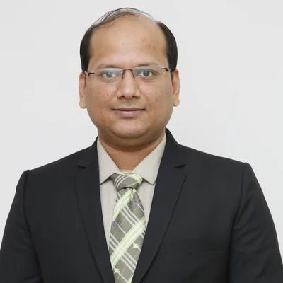 Dr. Manish Garg