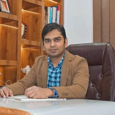 Dr. Neshar Ansari