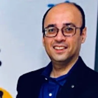 Dr. Malik Merchant